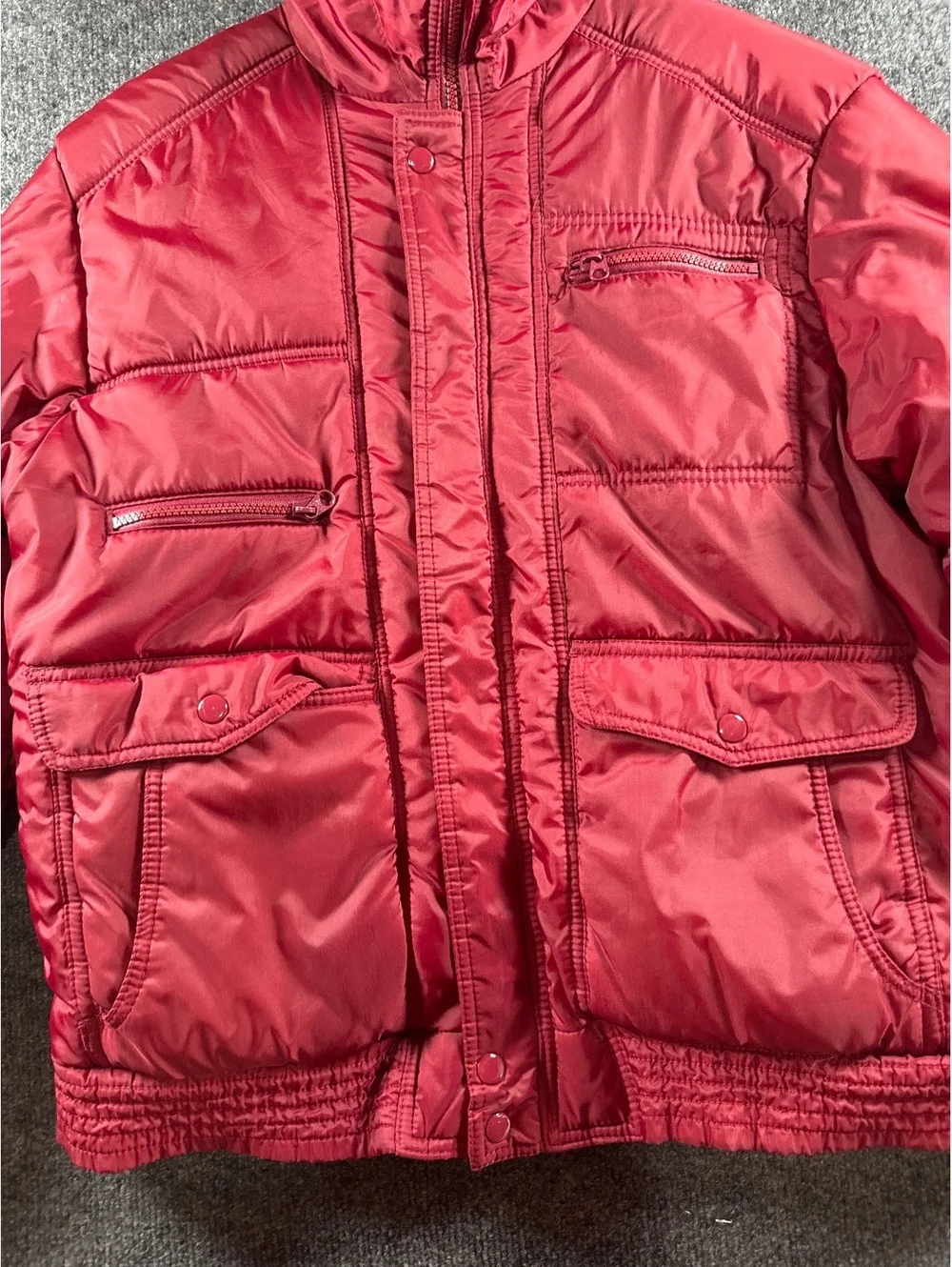 Red Quilted Puffer Jacket with Multiple Pockets and Zip Closure